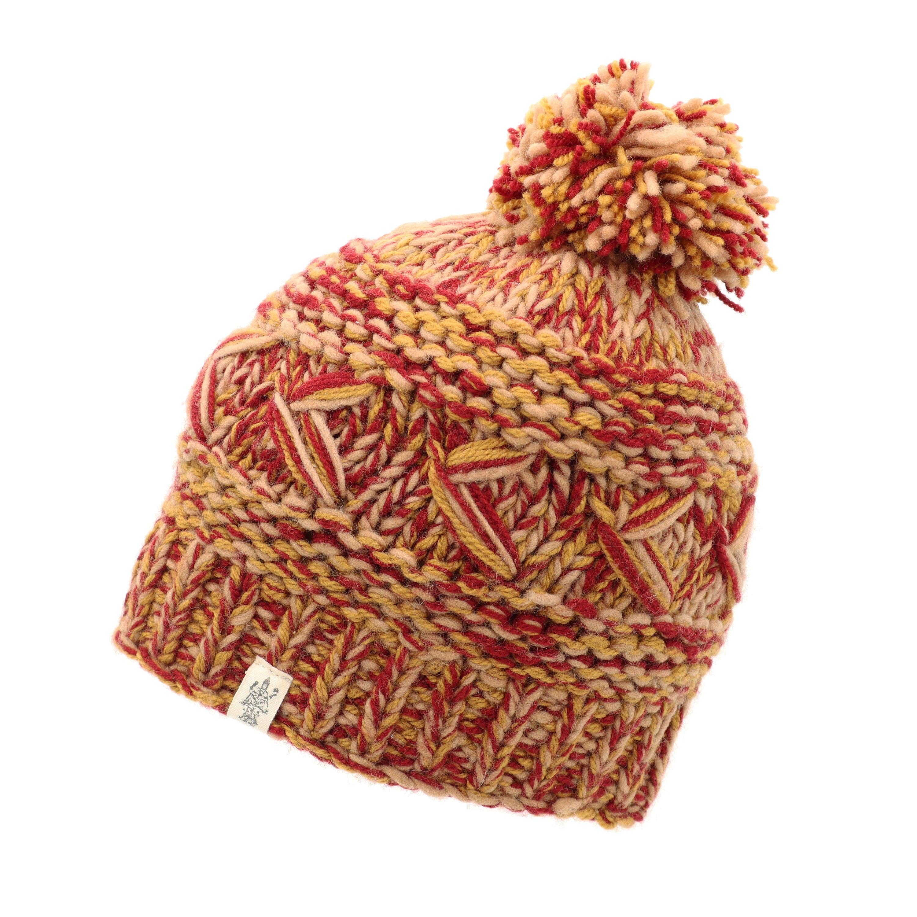 Reverse cross pom pom hat