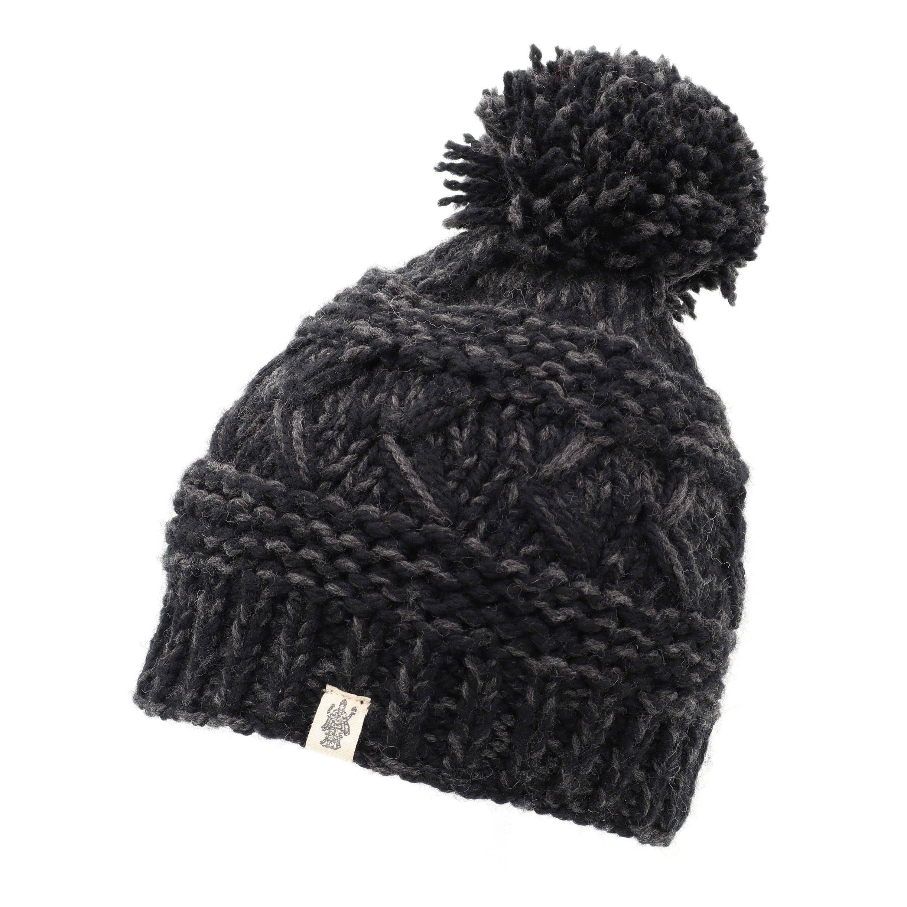 Reverse cross pom pom hat