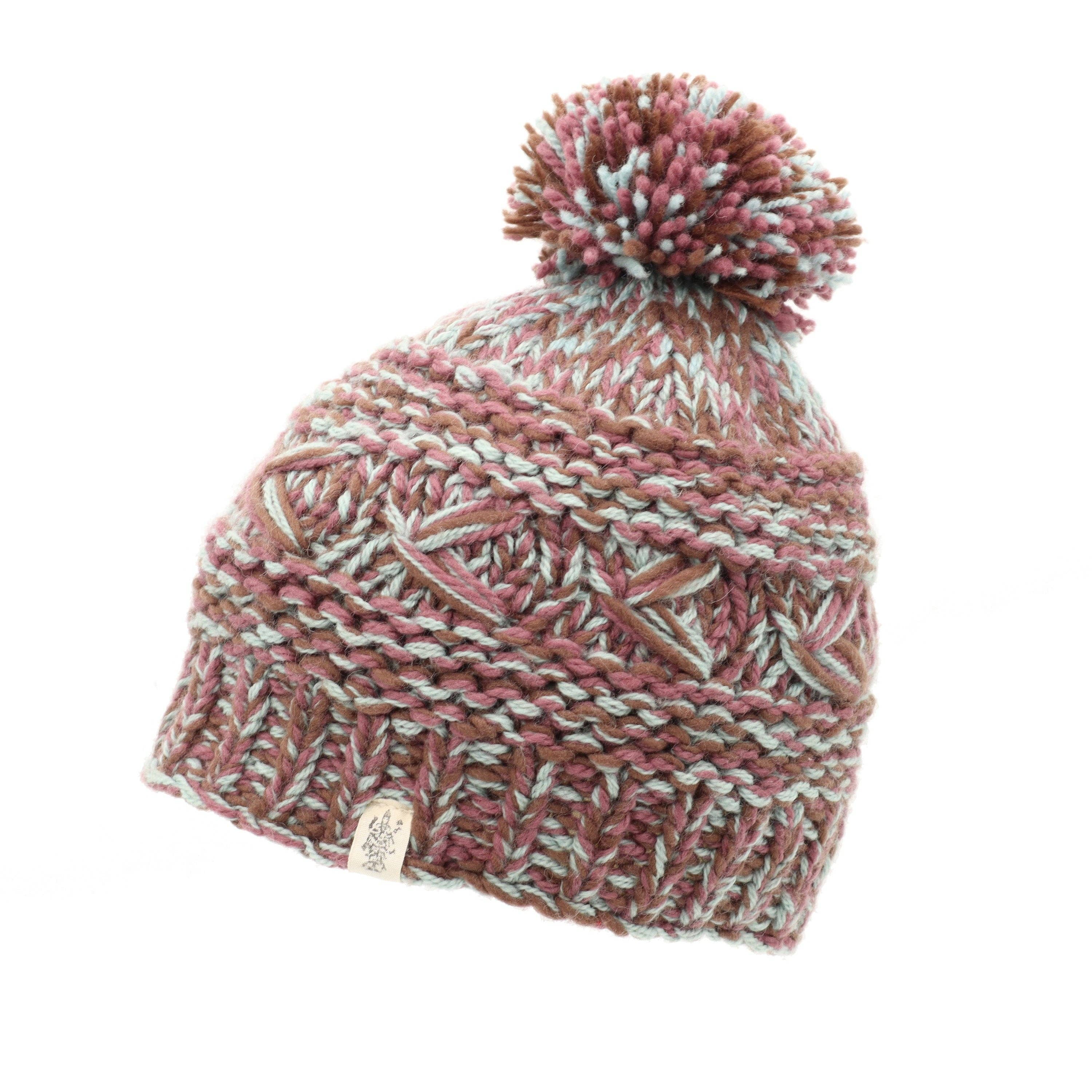 Reverse cross pom pom hat